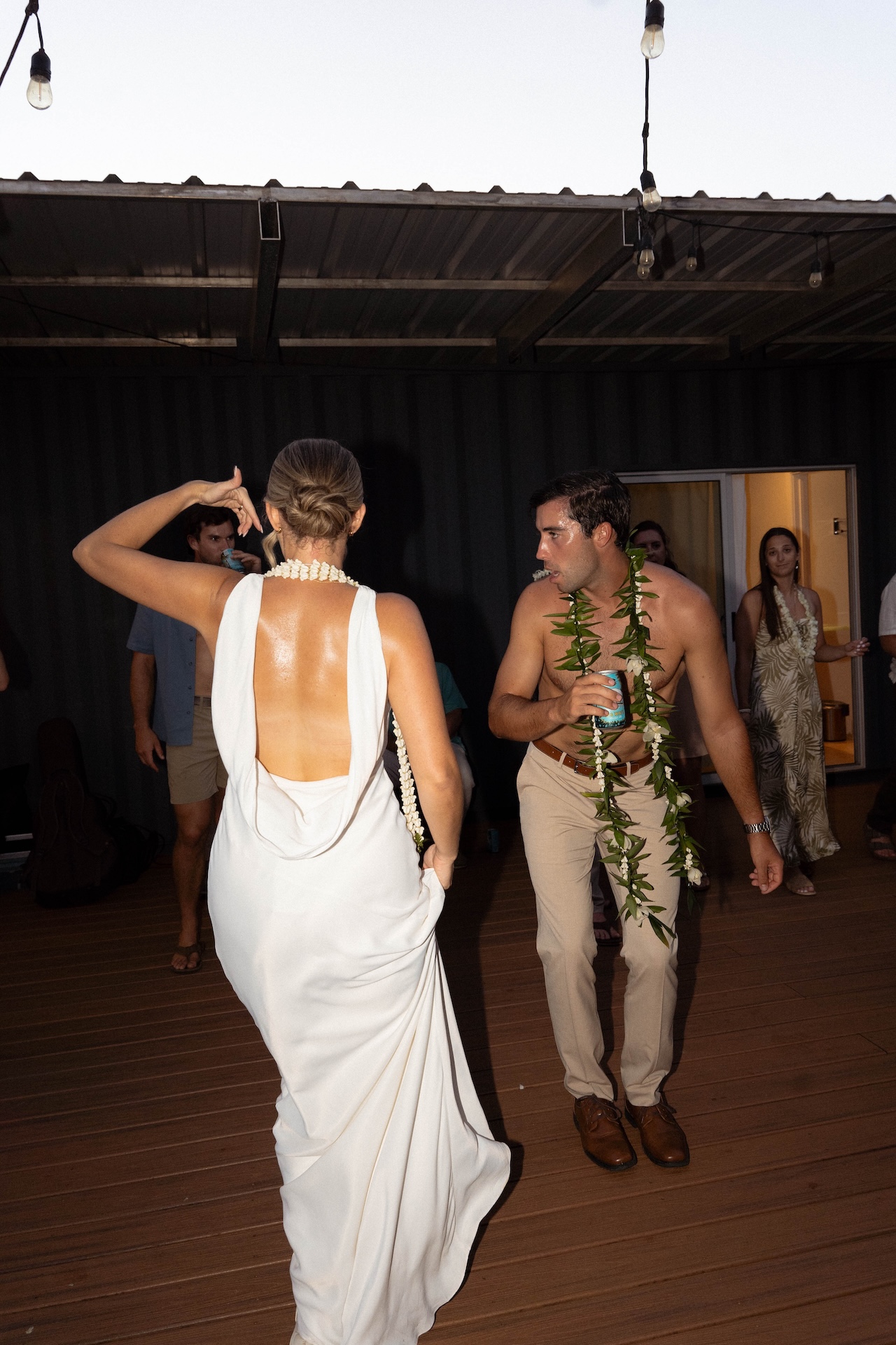 Bride and groom dancing on the dance floor together during their hawaii destination wedding