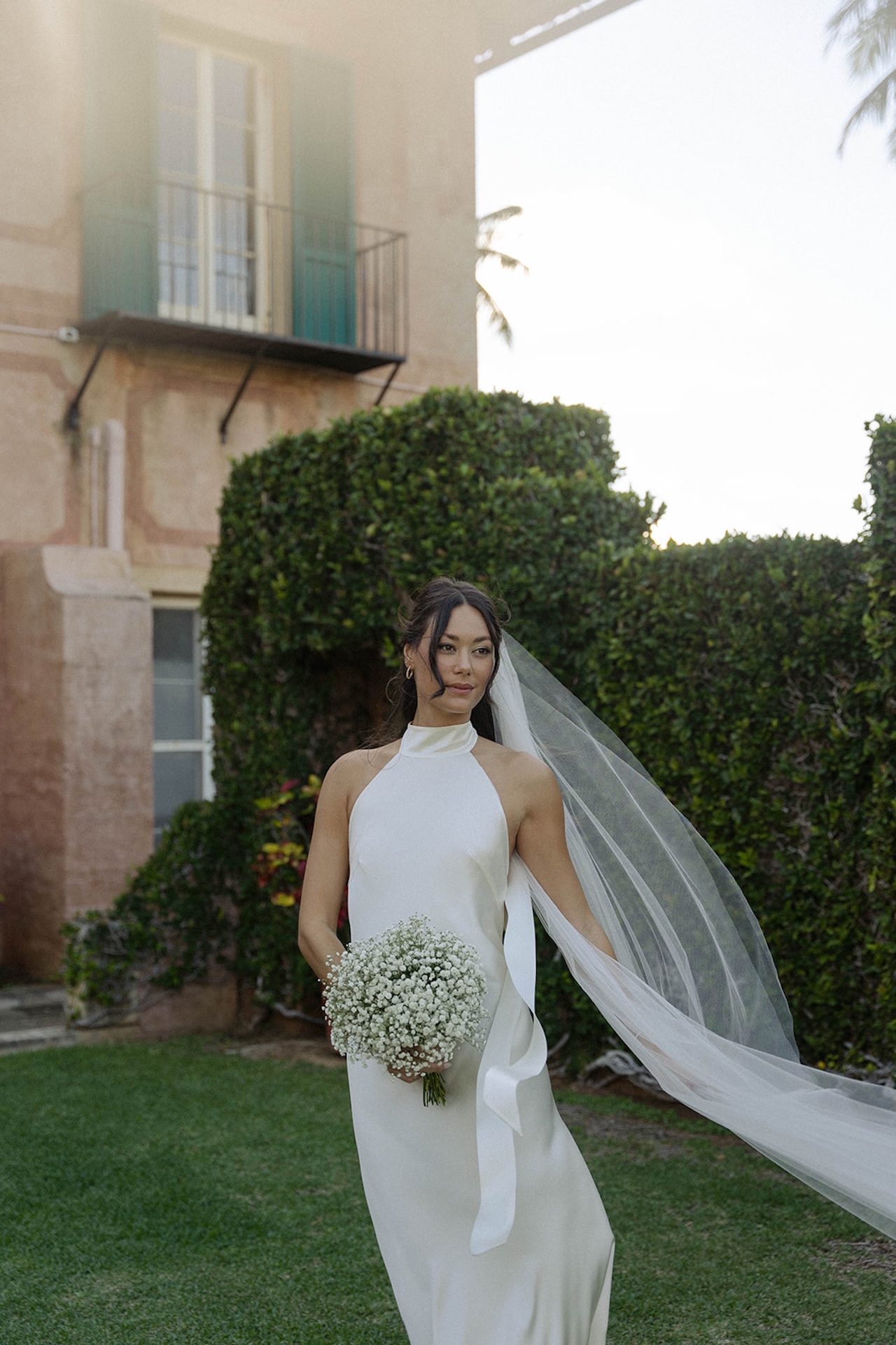 A serene bridal portrait capturing soft sunlight and natural beauty, perfect for showcasing an intimate wedding moment.