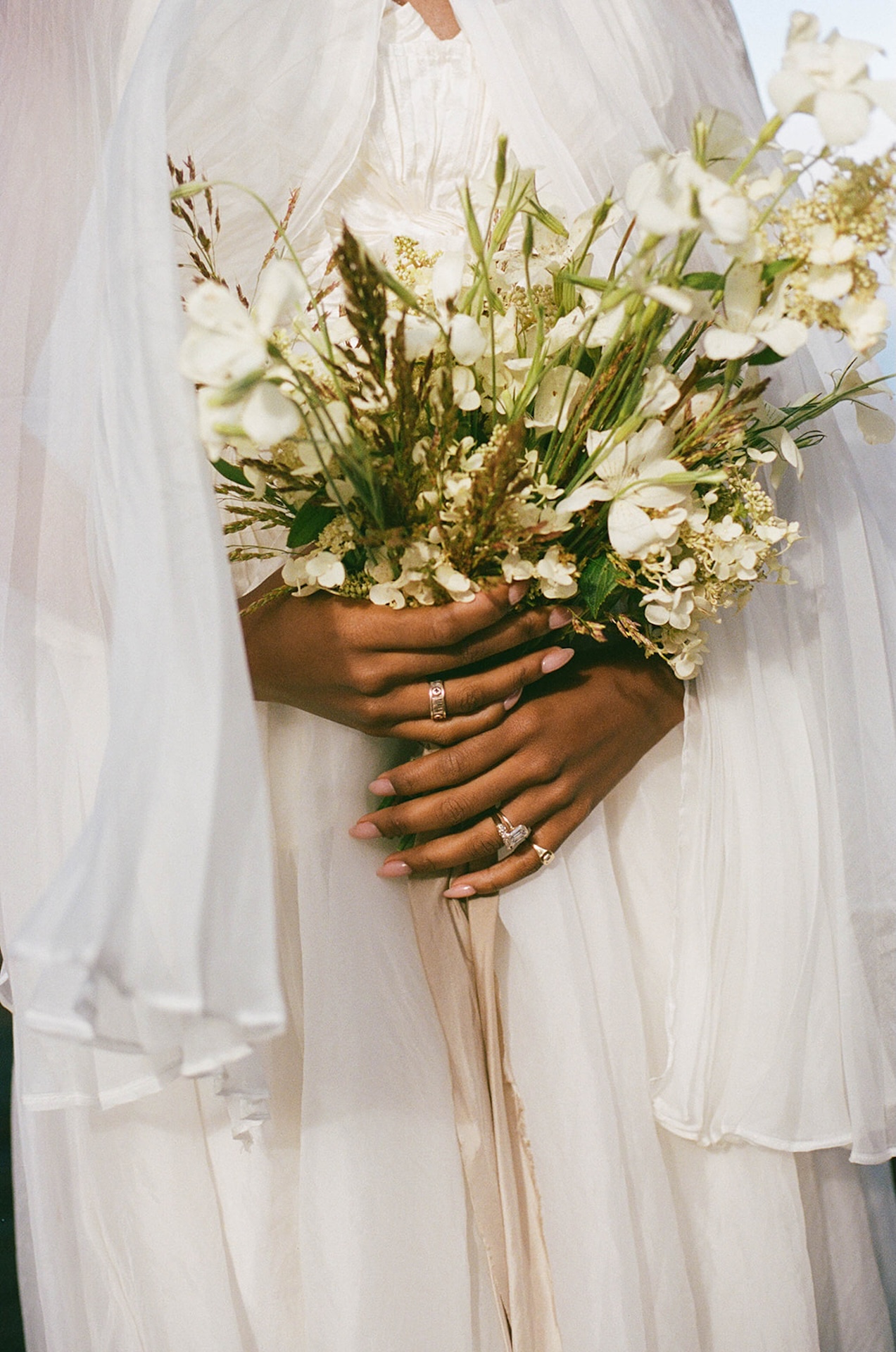 A close up of a bride holding her white wedding bouquet at her Sea Ranch Lodge Wedding
